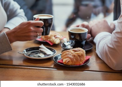 croissants and coffee, french breakfast in cafe in Paris for couple