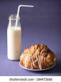 Croissants With Milk In Bottle With Straw