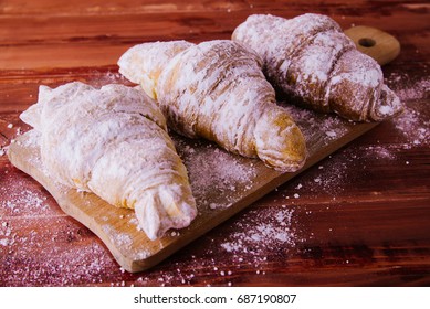 Croissants in powdered sugar - Shutterstock ID 687190807