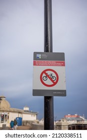 Cromer, Norfolk, UK – February 2022. No Cycling Sign Attached To Lamppost On The Promenade Along Cromer Beach On The North Norfolk Coast