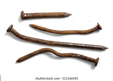 Crooked and rusty nails on a white background