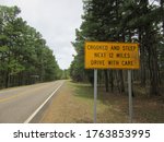 A "crooked and steep" road warning sign in the Ouachita mountains of Mena, Arkansas