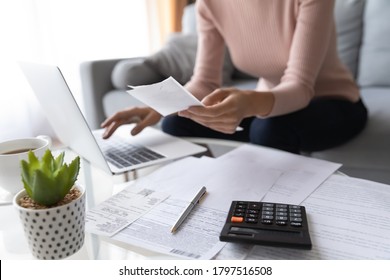 Crop close up of economical woman work on laptop at home pay bills taxes on gadget online, provident female calculate finances expenditures on machine, manage plan family household budget on computer - Shutterstock ID 1797516508