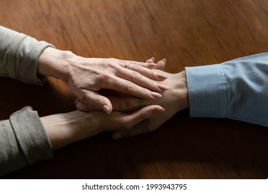 Crop Close Up Of Mature Woman Hold Old Husband Hand Show Love And Care In Relationships. Attentive Middle-aged Wife Comfort Caress Support Senior Man Spouse, Feel Supportive. Family Unity Concept.