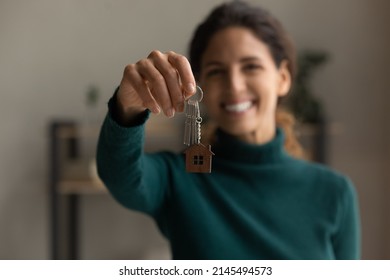 Crop Close Up Portrait Of Happy Millennial Latino Woman Show Keys To New House Or Apartment. Smiling Young Hispanic Female Renter Or Tenant Celebrate Relocation Moving To Own Home. Rent Concept.