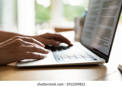 Crop close up of woman sit at desk use modern laptop gadget texting typing on keyboard. Female employee or student work online on computer, study distant on device. Technology, education concept. - Powered by Shutterstock