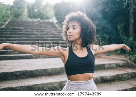 Similar – Image, Stock Photo A woman iis looking at her smartphone outdoors.