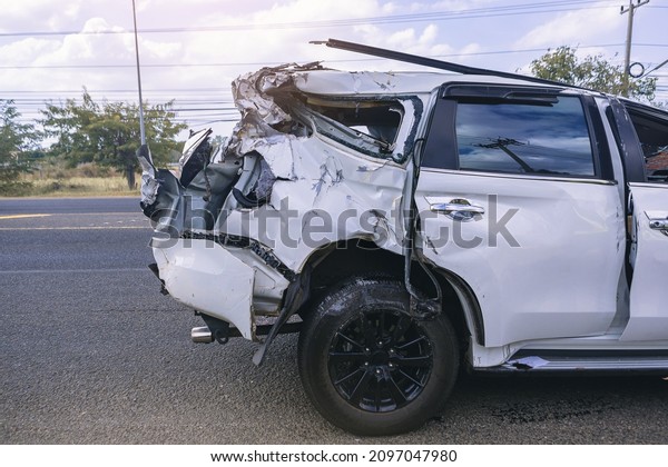 Crop image of car crash dangerous accident on\
the road. A car crashing damaged by another one on the road waiting\
for rescue.	
