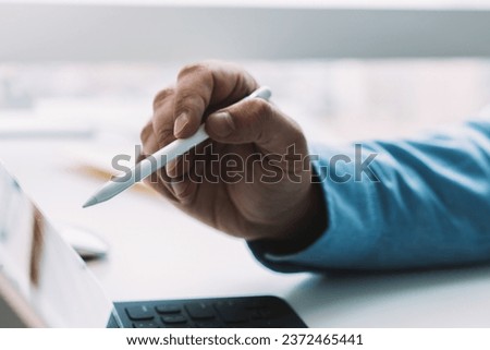 Similar – Image, Stock Photo Anonymous crop man using laptop on rocky cliff