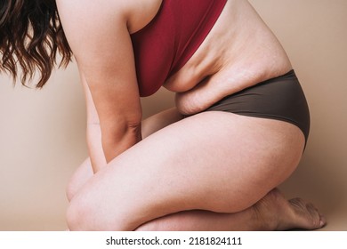 Crop Photo Of Real Young Woman Body Plus Size In Underwear Sitting On Beige Background, Body Love