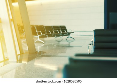 Crop Of Seats At Airport Interior, Empty Gate With Sunlight From Window. No People, Shallow Depth