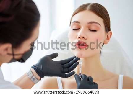 Similar – Image, Stock Photo Aesthetic Procedure Applying Botox, Hyaluronic Acid, and Tensor Threads