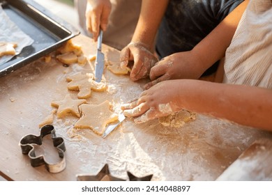 Crop view of children cutting out cookies - Powered by Shutterstock