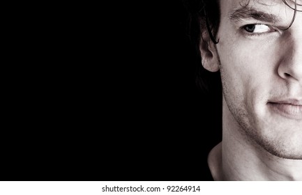 crop of young man's face looking at empty space - Powered by Shutterstock