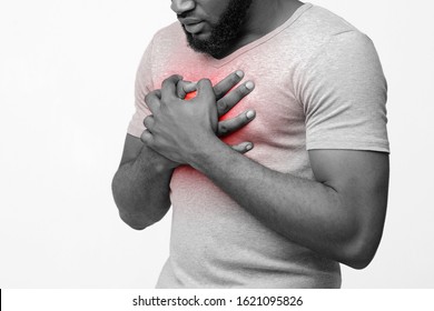 Cropped Of Afro Man Suffering From Acid Reflux Or Heartburn, Symptomatic Indigestion Or Gastritis Disease, White Background