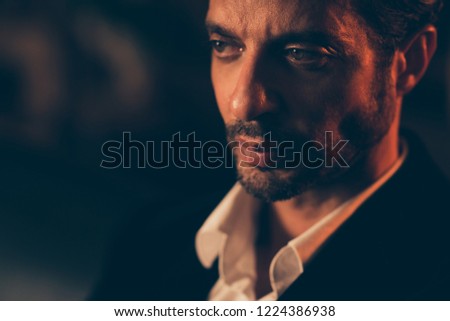 Similar – Young man with lost look in a modern pub.