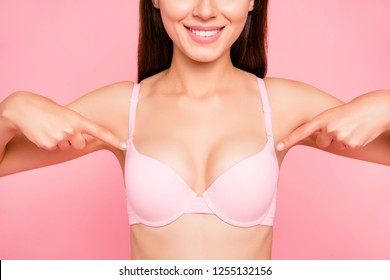 Cropped close up portrait of glad slim lovely with result her she girl showing fingers to perfect cleavage in pale pink bra isolated on pink background wellbeing concept