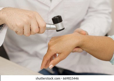 Cropped Close Up Of A Professional Dermatologist Checking Moles And Birthmarks Of A Patient With A Dermatoscope Examining Dermatology Cosmetology Skin Healthcare Medicine Concern Clinic Profession