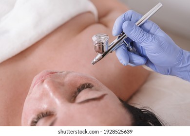 Cropped close up of a woman getting microdermabrasion facial skincare treatment