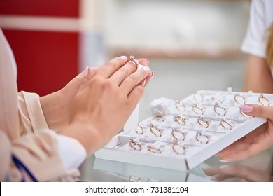 Cropped Close Up Of A Woman Trying On An Engagement Ring At The Jewelry Store.