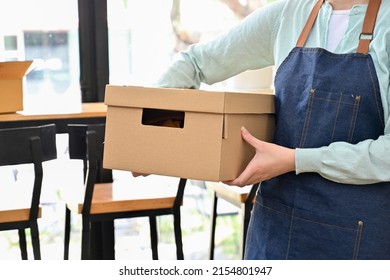 Cropped Close-up Image, Female Online Store Owner Holding A Cardboard Box Or Small Parcel Box. Small E-commerce Business