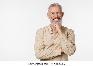 Cropped closeup portrait of caucasian mature middle-aged man in beige shirt looking at camera and smiling isolated in white background - Shutterstock ID 2175085665