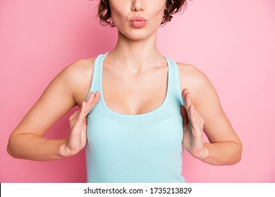 Cropped close-up portrait of her she nice attractive lovely cute lovable girl touching chest showing push-up volume size boost effect isolated over pink pastel color background