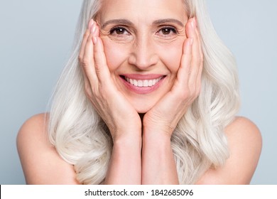 Cropped close-up view portrait of her she nice attractive cheery grey-haired elderly lady beaming smile isolated on gray pastel color background