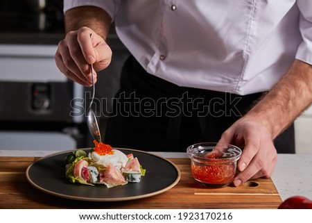 Similar – Image, Stock Photo Crop cook preparing meat and hotdog on grill machine