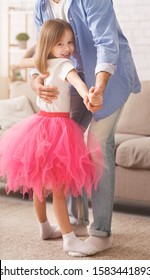 Cropped Of Dad Teaching Little Daughter Dancing At Home, Girl Staying On Father Feet And Smiling At Camera