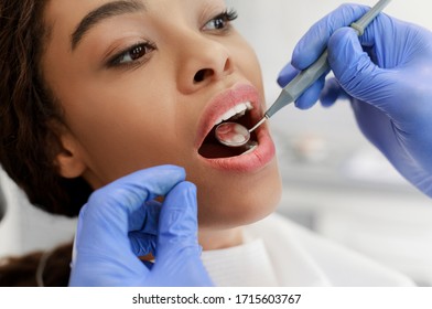 Cropped Of Dentist Hands In Gloves Holding Tools And Checking Black Woman For Caries