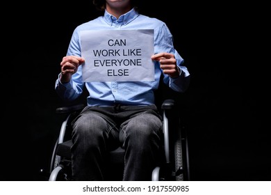 cropped disabled man can work as anyone else, holding paper job search. isolated black background