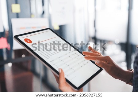 Cropped female professional employee using modern touch pad for reading business web article, unrecognizable executive manager connecting to 4g wireless internet on digital tablet for browsing