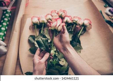 Cropped first view photo of small business representative people person youth hold hand handmade rosebud leaves masterclass desk desktop table occupation