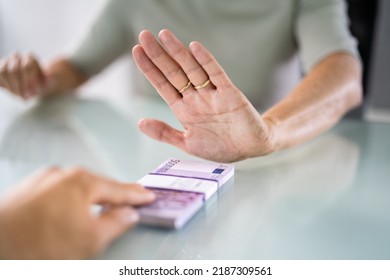Cropped Hand Of Businessperson Refusing To Take Bribe From Partner At Workplace - Shutterstock ID 2187309561