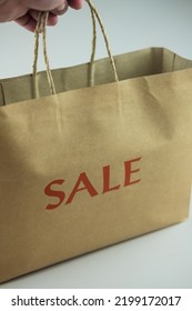 Cropped Hand Of Person Holding Brown Paper Bag, Paper Shopping Bag