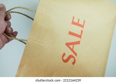 Cropped Hand Of Person Holding Brown Paper Bag, Paper Shopping Bag