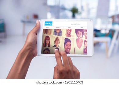 Cropped Hands Of Female Executive Using Tablet Computer Against Head Shots Of People On Dating Site Wallpaper 