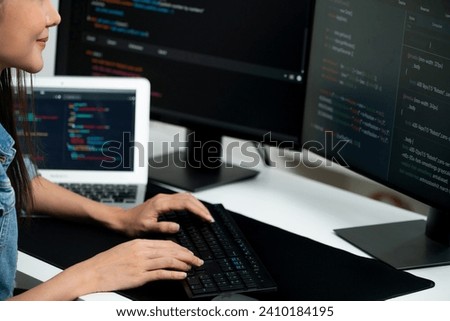 Cropped hands image of IT developer creating with typing information on pc with coding program information data website application, wearing jeans shirt surround safety analysis two screen. Stratagem.