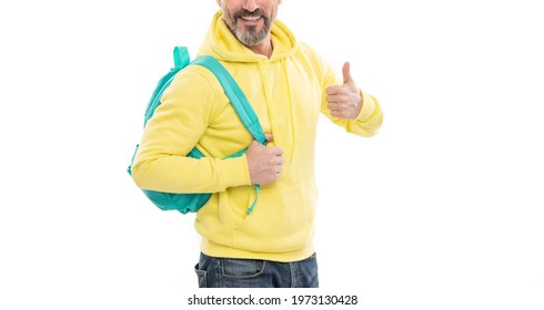 Cropped Happy Man Carry Backpack. Smiling Guy Back To School Isolated On White. Cropped Man In Yellow Hoody With School Bag. Education For Adult. Male Casual Style. Thumb Up Gesture.