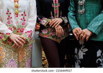 Cropped image of Asian woman in traditional Malay Batik Kebaya or Baba Nyonya dress. Selective focus image.