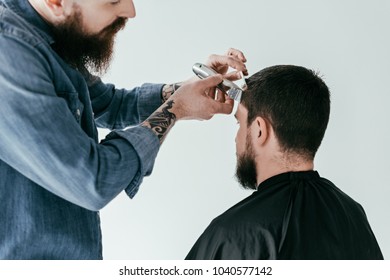 cropped image of barber shaving hair at barbershop isolated on white - Powered by Shutterstock