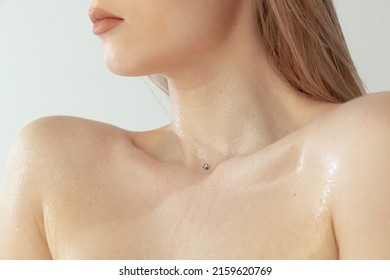 Cropped image of beautiful female body, tender slim collarbone isolated over grey studio backgrorund. Natural beauty. Concept of female body, skin care, cosmetology, spa, plastic surgery, ad