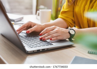 Cropped image of business woman hand working laptop computer in home office - Shutterstock ID 1767734033