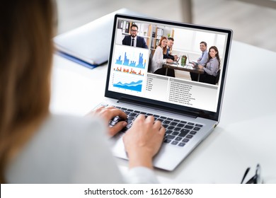 Cropped Image Of Businesswoman Using Laptop At Desk - Powered by Shutterstock