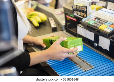 Cropped Image Of Cashier Scanning Juice Pack's Barcode