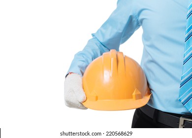 Cropped image of engineer holding yellow hardhat
