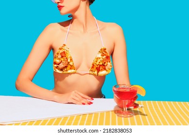Cropped image of female body, cocktail on yellow tablecloth and pizza element on cloth isolated on blue background Food pop art. Vintage, retro style. Complementary colors, Copy space for ad, text