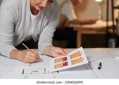 Cropped Image Of Female Civil Engineer Drawing House Blueprint