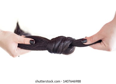 Cropped Image Of Female Hands Pulling Strand Of Healthy Strong Brown Hair